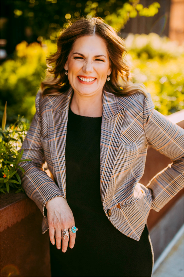 Jane Kleeb standing and smiling at the camera